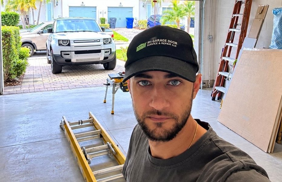 911 Garage Door technician in the workshop